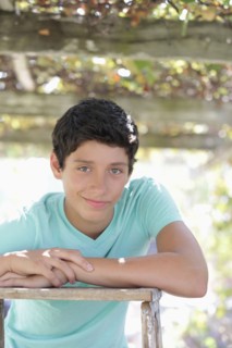 Portrait of smiling teenage boy (14-15) in vineyard. Photo : pauline st.denis