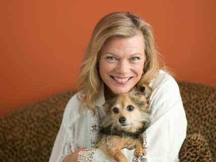 Mature woman playing with dog. Photo : Dan Bannister