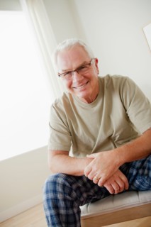 Portrait of cheerful senior man wearing spectacles. Photo : Rob Lewine