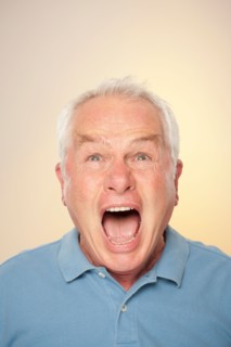 Portrait of senior man screaming. Photo : Rob Lewine