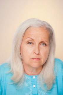 Portrait of senior woman with suspicious face expression. Photo : Rob Lewine