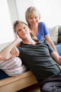 Portrait of couple in bedroom. Photo : Rob Lewine