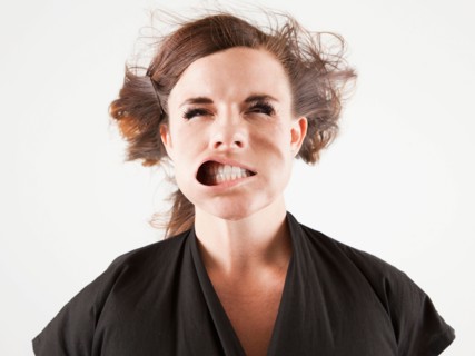 Studio portrait of young woman facing wind. Photo: Jessica Peterson