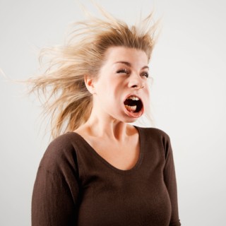 Studio shot of woman with windblown mouth. Photo : Jessica Peterson