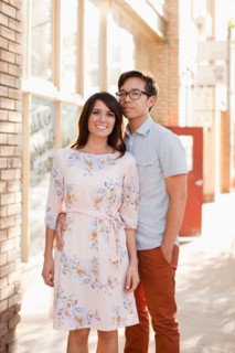 Portrait of couple standing on sidewalk. Photo : Jessica Peterson
