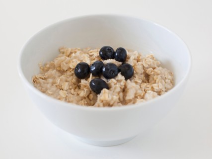 Oatmeal with blueberries on white background. Photo : Jessica Peterson