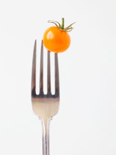 Studio Shot of Cherry Tomatoes on fork. Photo : Jessica Peterson