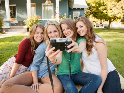 Portrait of four friends taking picture of themselves. Photo : Jessica Peterson