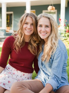 Portrait of two young women cheek to cheek. Photo : Jessica Peterson