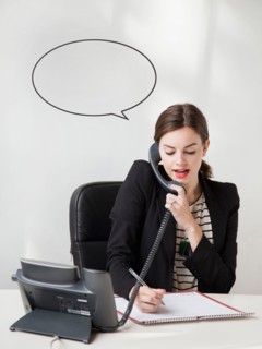 Studio shot of young woman talking on phone with speech bubble next to her head. Photo: Jessica
