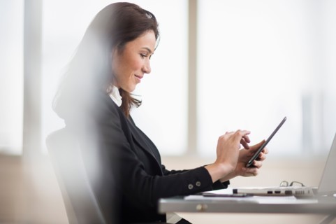 Businesswoman using tablet pc.