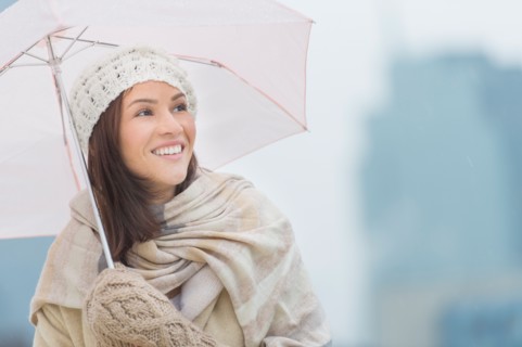Portrait of woman with umbrella.