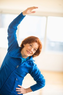 Senior woman stretching.