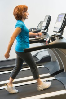 Senior woman on treadmill.