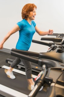 Senior woman on treadmill.