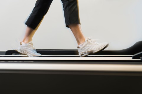 Low section of woman on treadmill.