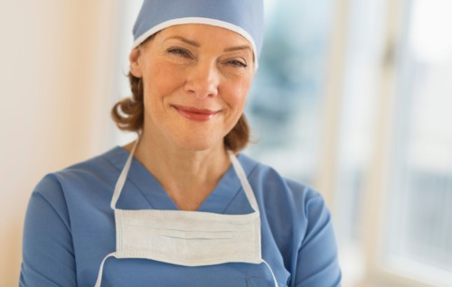 Portrait of smiling female surgeon.