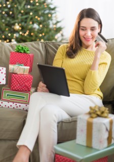 Woman buying christmas gift via internet.