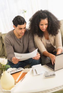 Couple doing home finances.