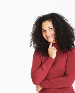 Studio portrait of mid adult woman.