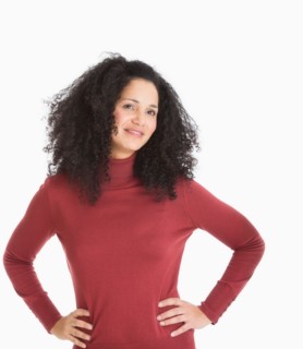 Studio portrait of mid adult woman.