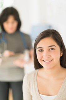 Teenage girl (16-17) in doctor's office.