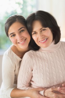 Portrait of grandmother and granddaughter (16-17).