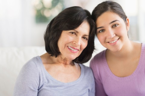 Portrait of grandmother and granddaughter (16-17).