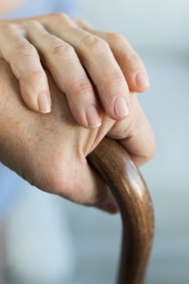 Close-up of hands of grandmother and granddaughter (16-17).