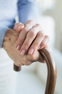 Close-up of hands of grandmother and granddaughter (16-17).
