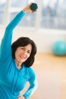 Portrait of senior woman exercising.