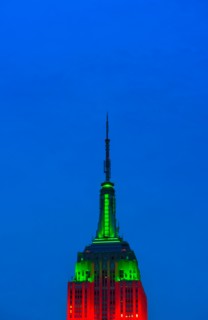 Empire State Building illuminated in red and green.