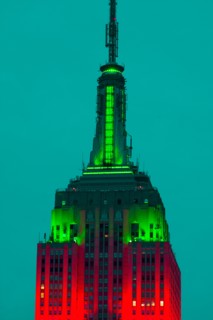 Empire State Building illuminated in red and green.