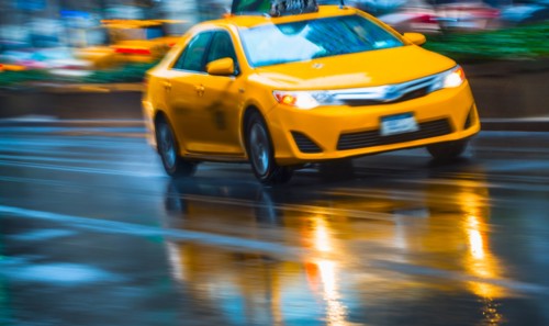 Yellow cab in blurred motion.