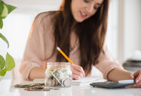 Young woman counting bills