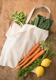 Studio shot of organic vegetables in shopping bag