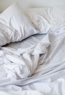 White bedclothing in mess