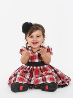 Portrait of Baby girl ( 6-11 months) wearing plaid dress