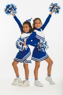Portrait of cheerleaders (8-9 years) ( 10-11 years) holding pom-pom