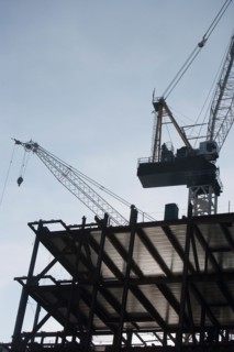 Low angle view of crane and building under construction