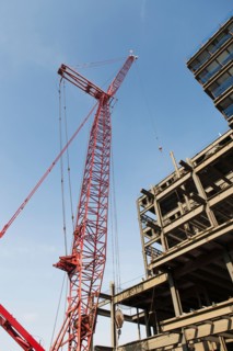 Low angle view of crane and building under construction