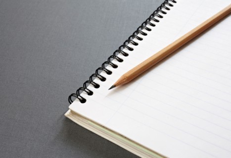 Empty note pad with pencil