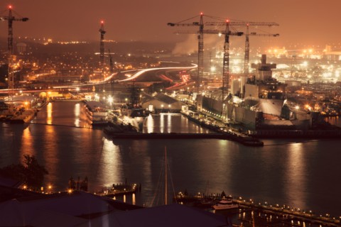 Cityscape with cranes at night