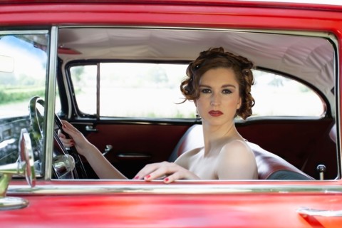 Portrait of elegant woman in vintage car