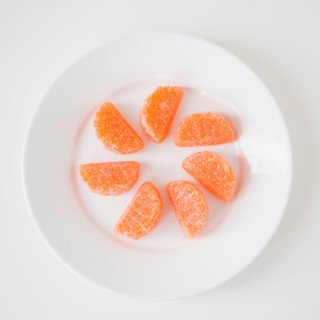 Studio Shot of candies imitating orange