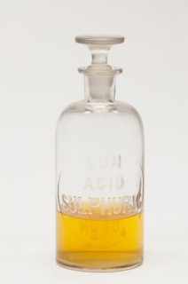 Laboratory flask containing yellow liquid