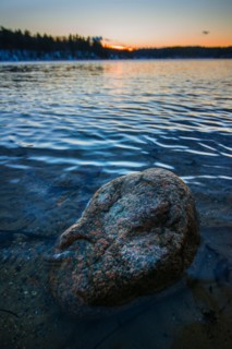 Boulder in water. Walden Pond, Concord, Massachusetts.