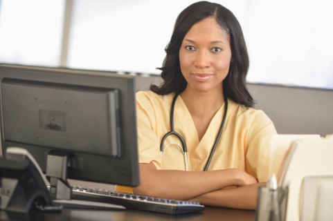 Portrait of female nurse at station.
