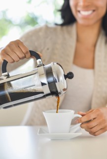 Woman pouring coffee.