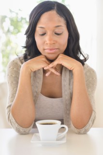Woman drinking coffee.